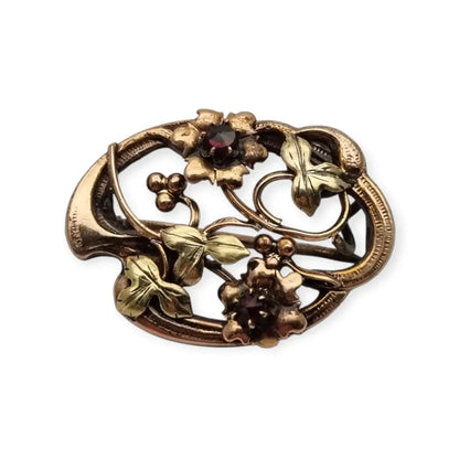 Broche Art Nouveau floral en oro laminado y rosa con granates el sello
