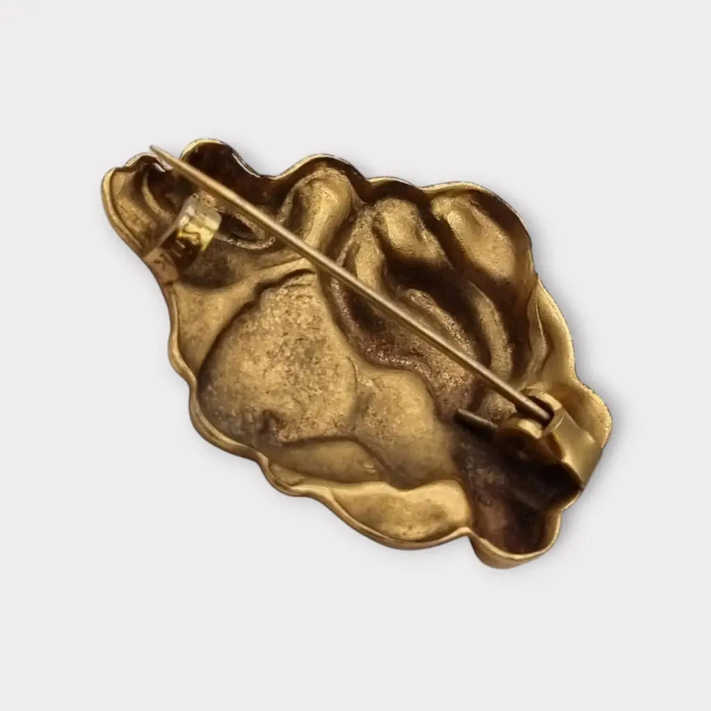 Broche de cabeza contemporáneo marca sunsilk en latón dorado. Bisutería