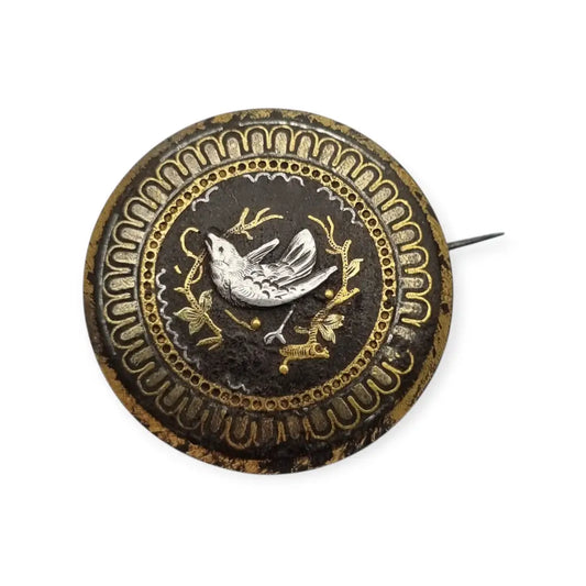 Broche damasquinado oro de Toledo con motivo pájaro grabado años 1920.