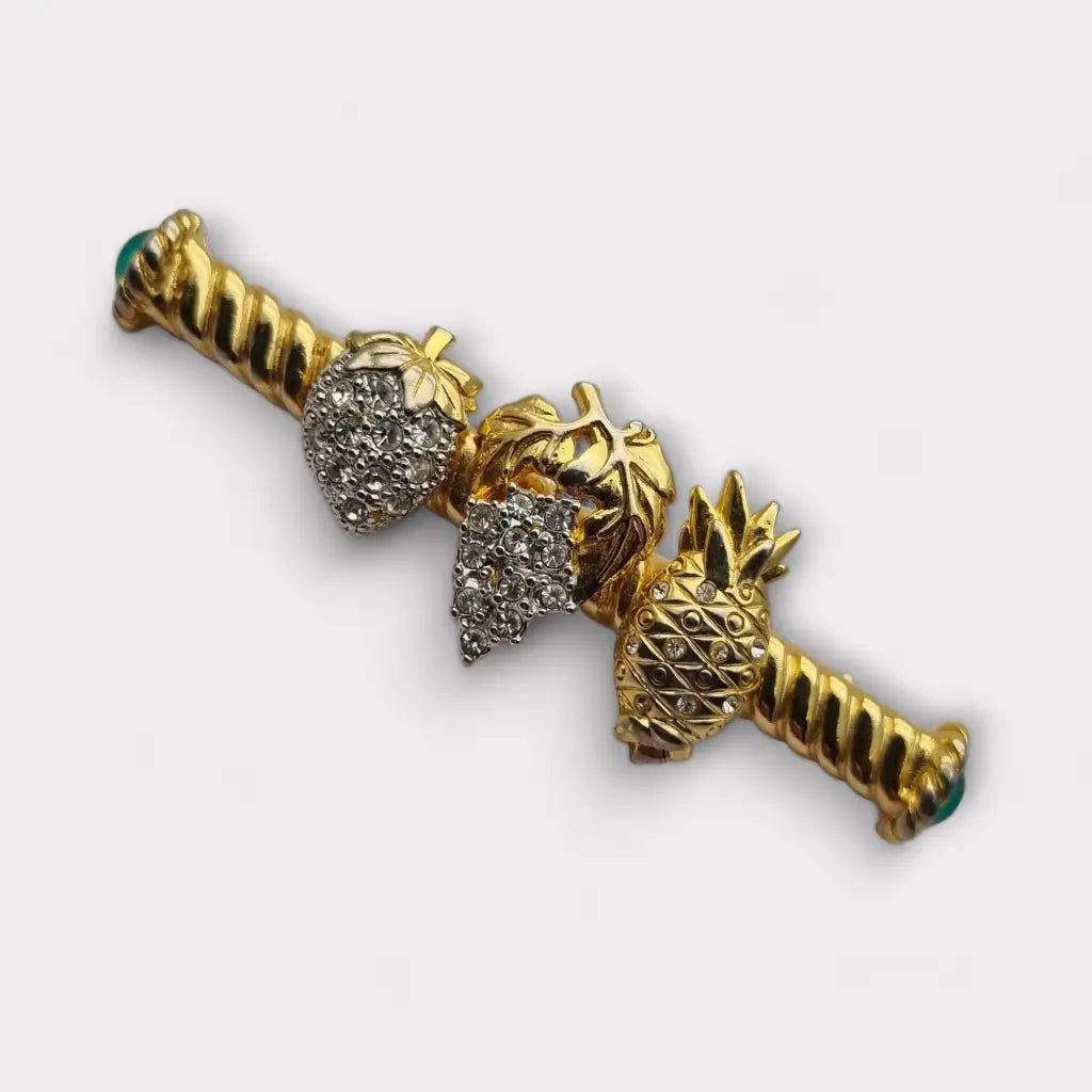 Broche de fruta con diamantes imitación dorados pinchos verdes