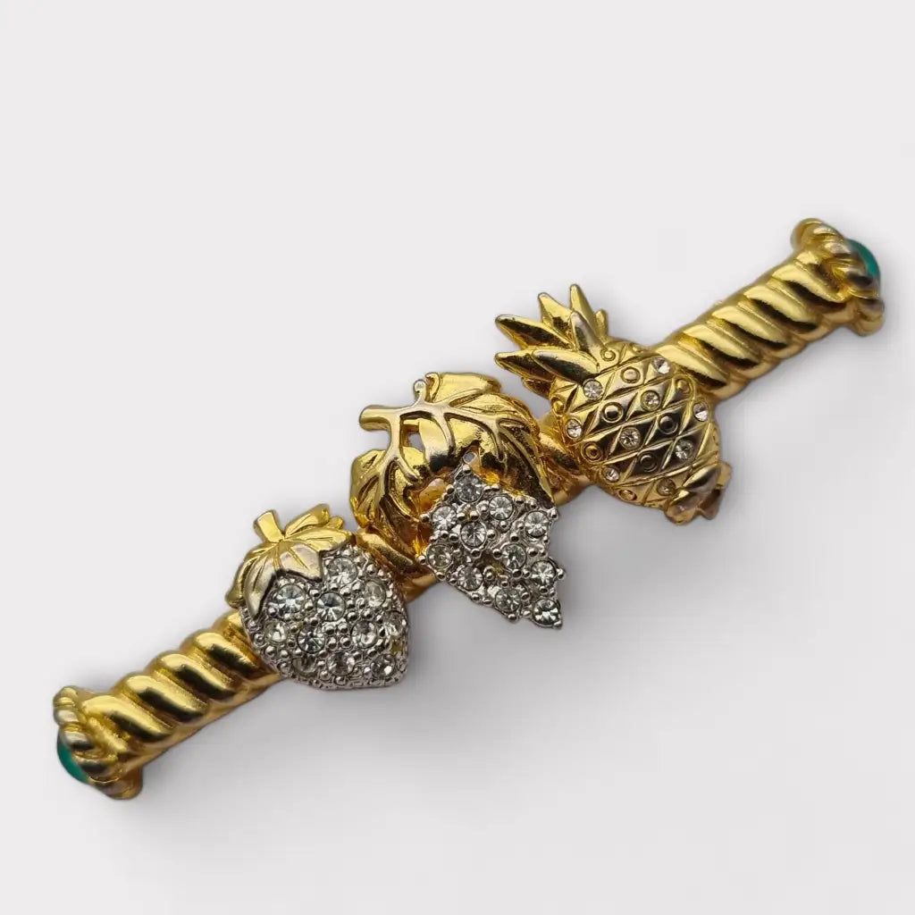 Broche de fruta con diamantes imitación dorados pinchos verdes