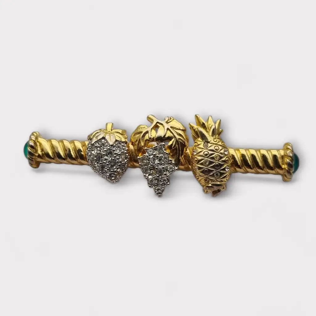 Broche de fruta con diamantes imitación dorados pinchos verdes