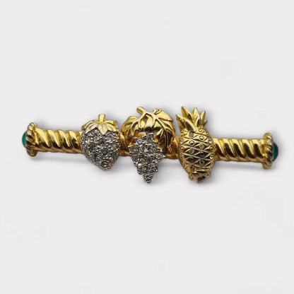 Broche de fruta con diamantes imitación dorados pinchos verdes