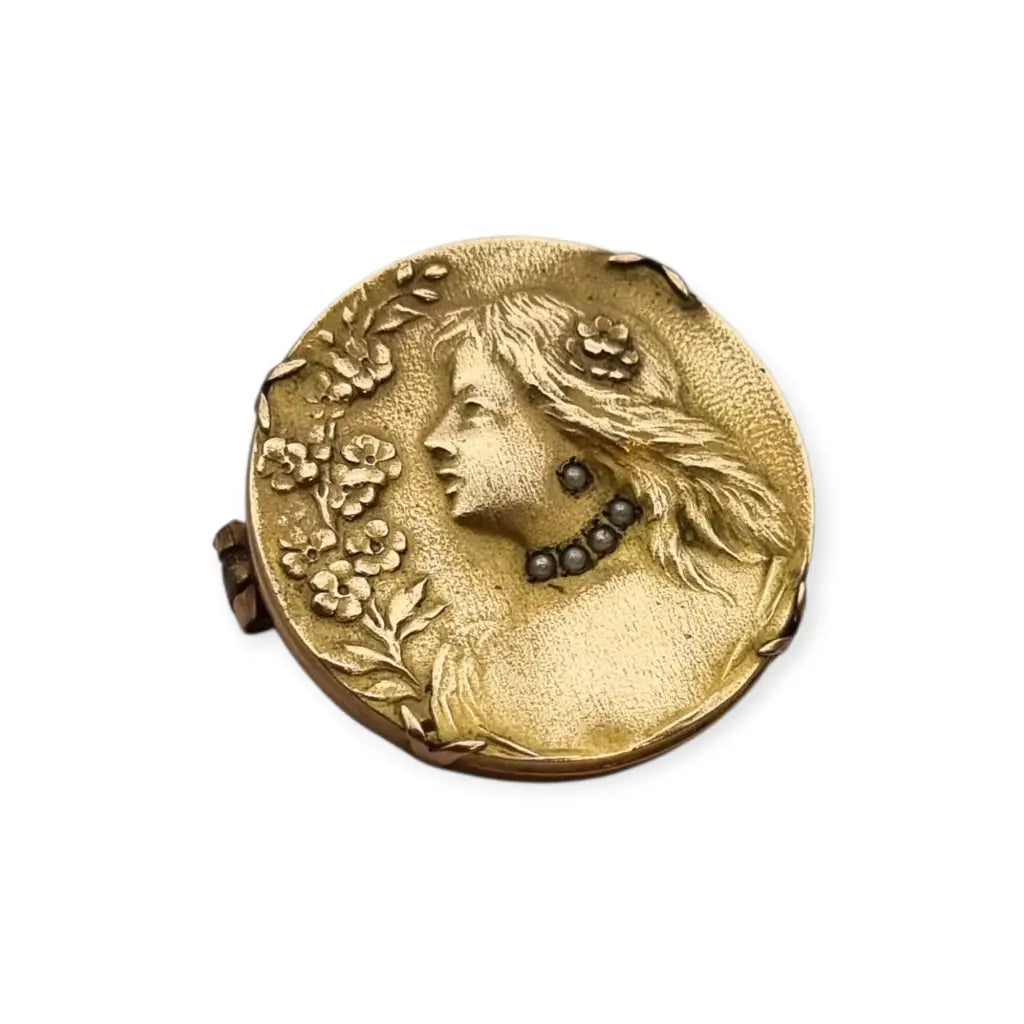 Broche redondo dorado art nouveau con perfil femenino y perlas joyas antiguas