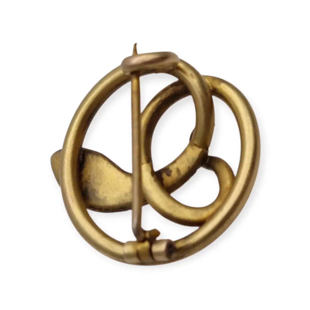 Broche victoriano antiguo en metal dorado con serpiente entrelazada y ojo