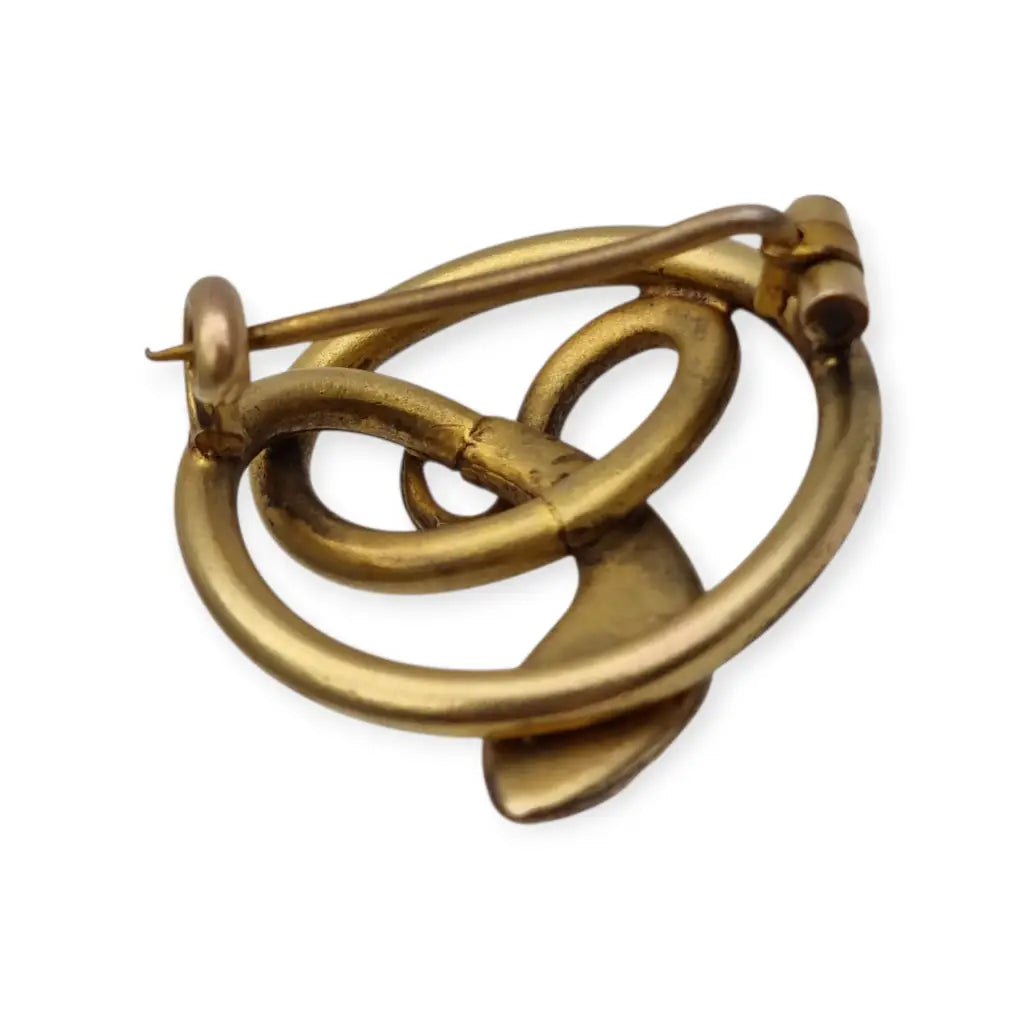 Broche victoriano antiguo en metal dorado con serpiente entrelazada y ojo