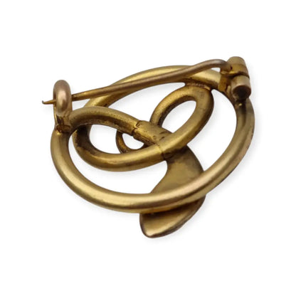 Broche victoriano antiguo en metal dorado con serpiente entrelazada y ojo