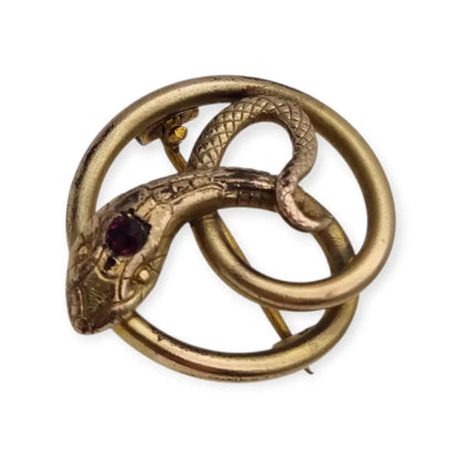 Broche victoriano antiguo en metal dorado con serpiente entrelazada y ojo