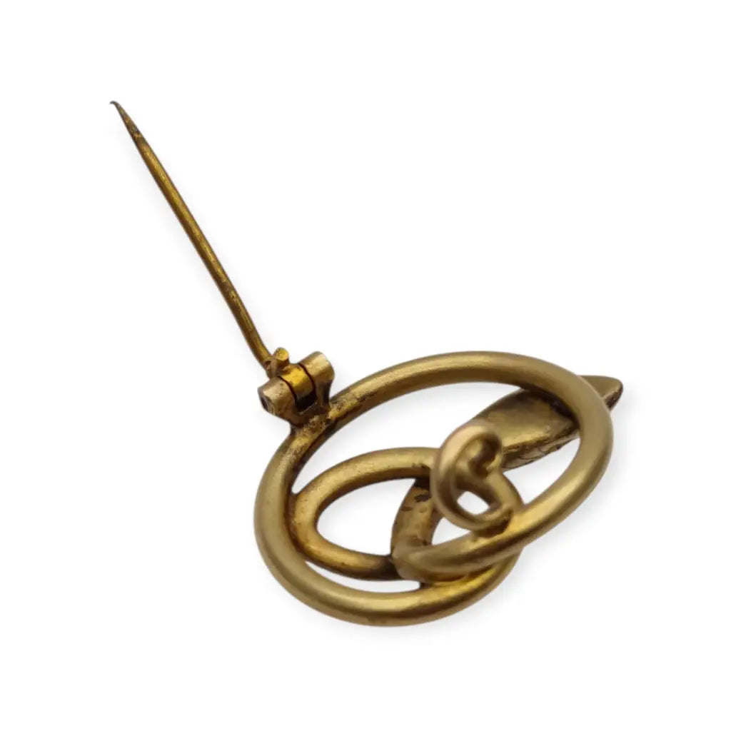 Broche victoriano antiguo en metal dorado con serpiente entrelazada y ojo