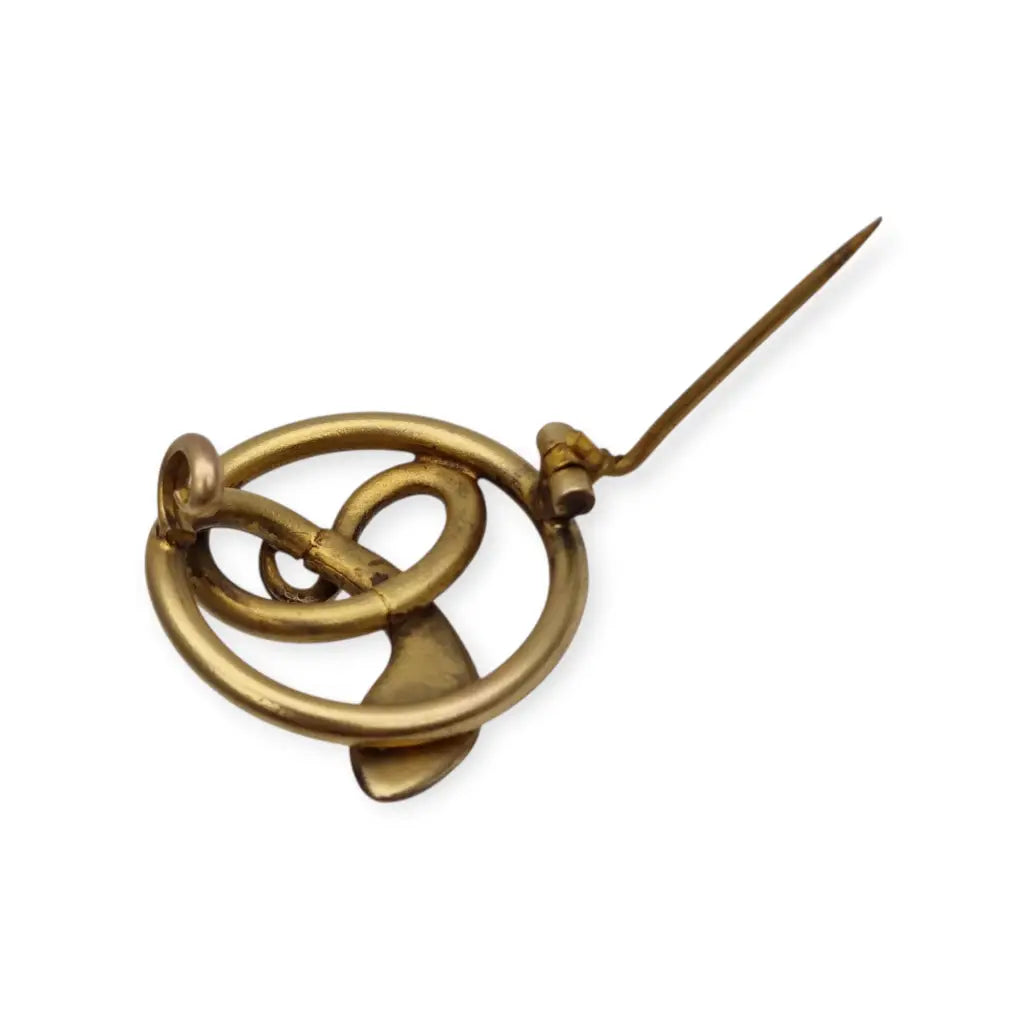Broche victoriano antiguo en metal dorado con serpiente entrelazada y ojo