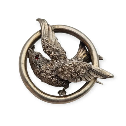 Broche victoriano en plata con pájaro y círculo símbolo de amor 1900.