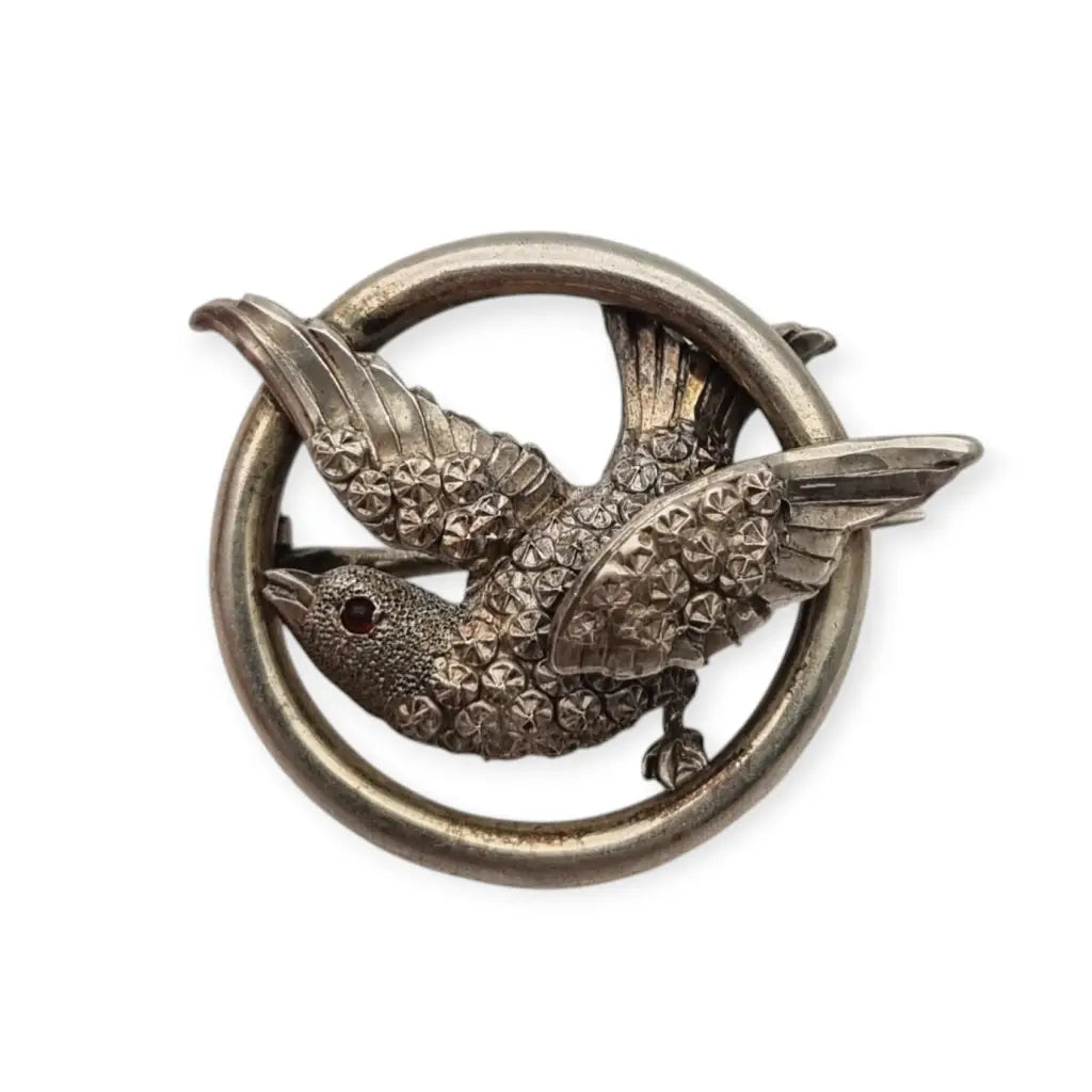 Broche victoriano en plata con pájaro y círculo símbolo de amor 1900.