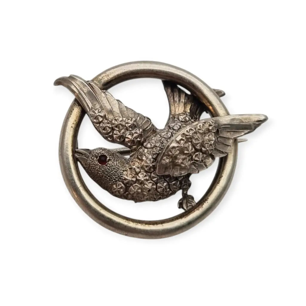 Broche victoriano en plata con pájaro y círculo símbolo de amor 1900.