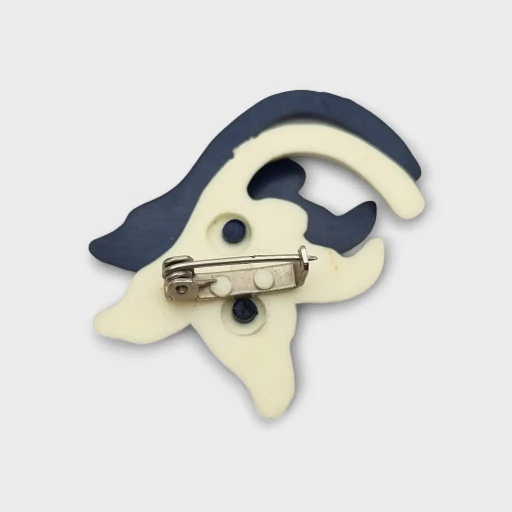 Broche vintage años 50 60 en plástico azul marino y beige con diseño floral