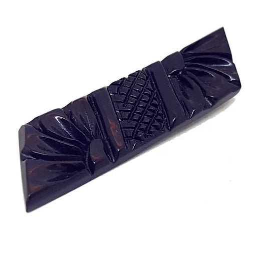 Broche vintage de baquelita negra tallas geométricas para la solapa