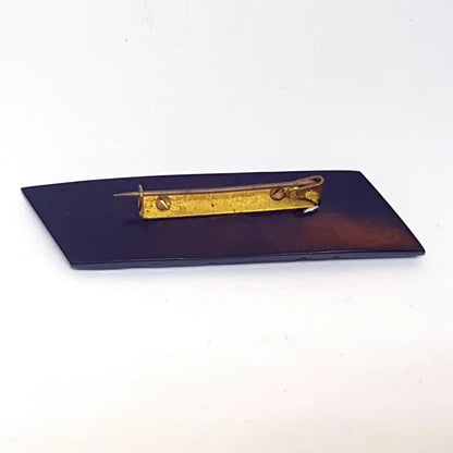 Broche vintage de baquelita negra tallas geométricas para la solapa