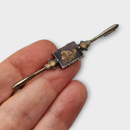 Broche Vintage con flores prensadas encapsuladas circa 1970 estilo art deco.