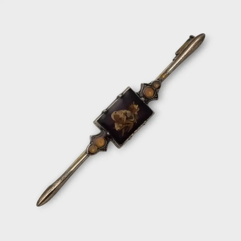 Broche Vintage con flores prensadas encapsuladas circa 1970 estilo art deco.