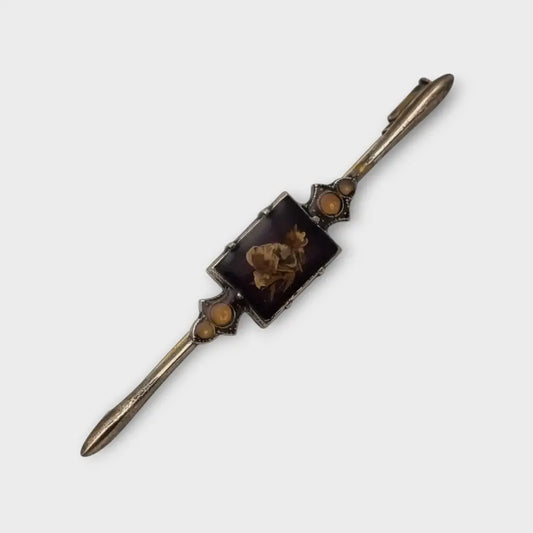 Broche Vintage con flores prensadas encapsuladas circa 1970 estilo art deco.