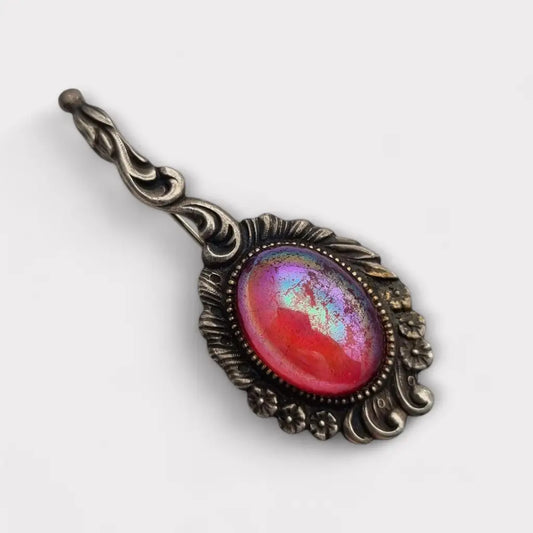 Broche vintage de plata con piedra rosa iridiscente forma alargada los años