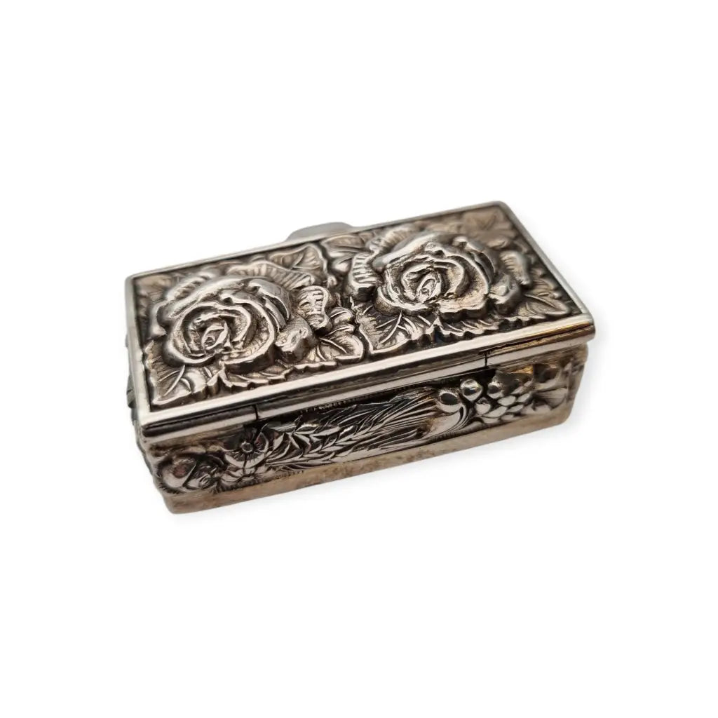 Caja de plata Inglesa la marca Ari D. Norman con rosas repujadas Londres