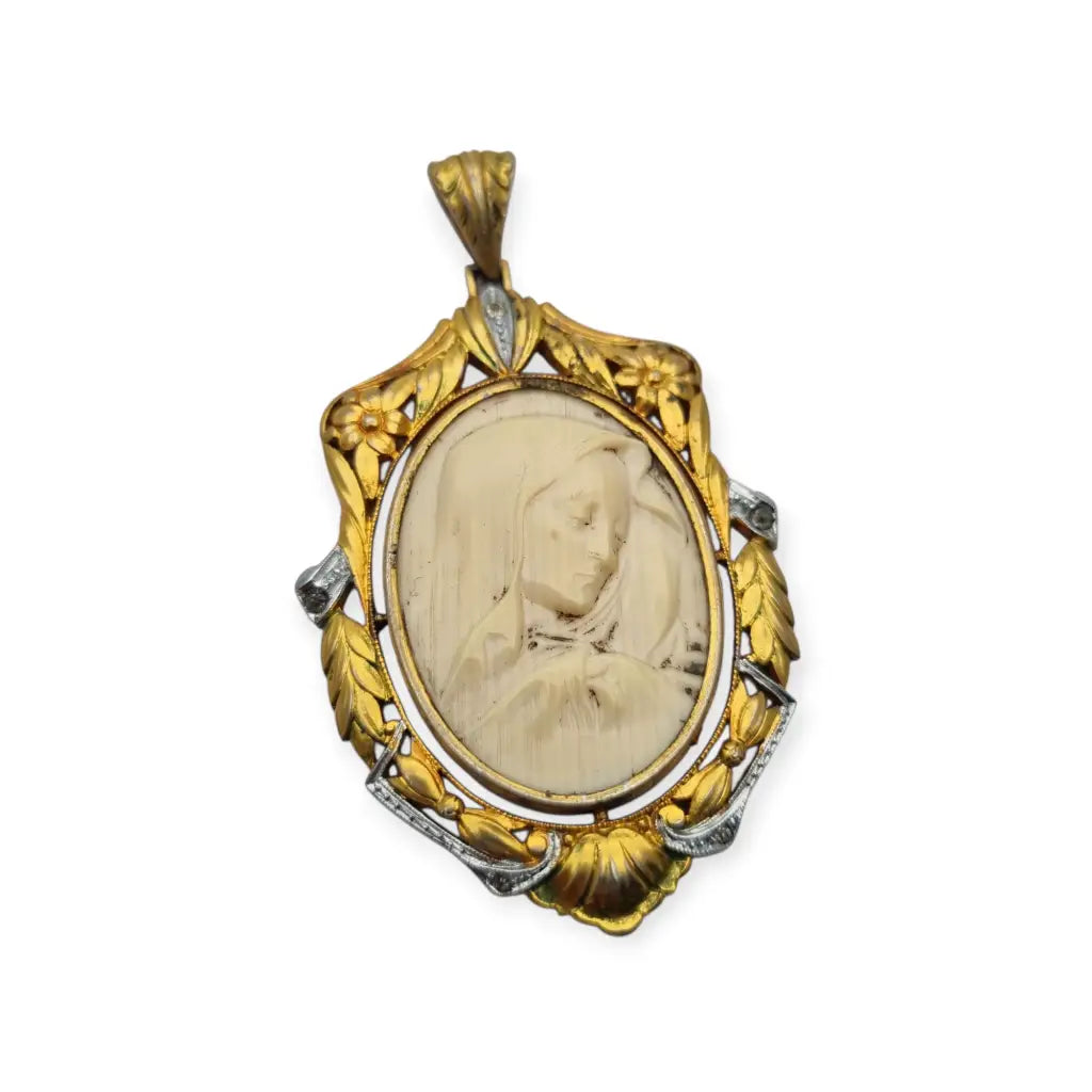 Colgante Art Nouveau de la Virgen década 1910 en celuloide y metal dorado