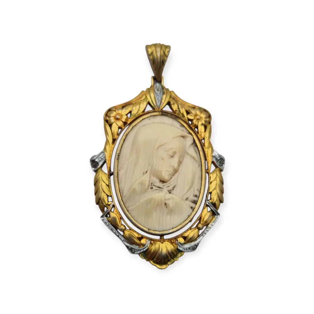 Colgante Art Nouveau de la Virgen década 1910 en celuloide y metal dorado
