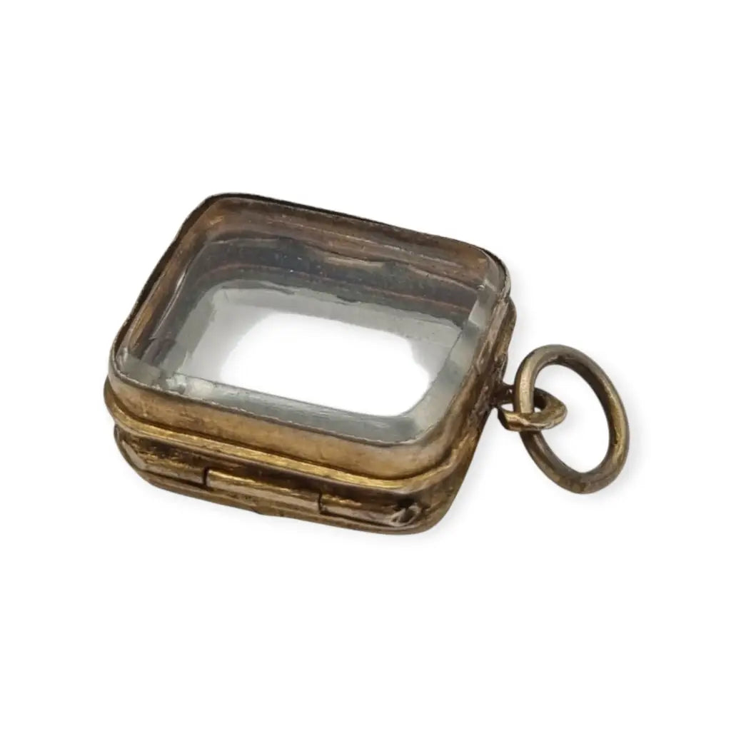 Colgante guardapelo antiguo rectangular doble cristal latón dorado siglo xix–xx.