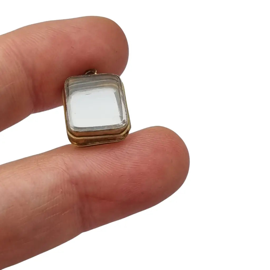 Colgante guardapelo antiguo rectangular doble cristal latón dorado siglo xix–xx.