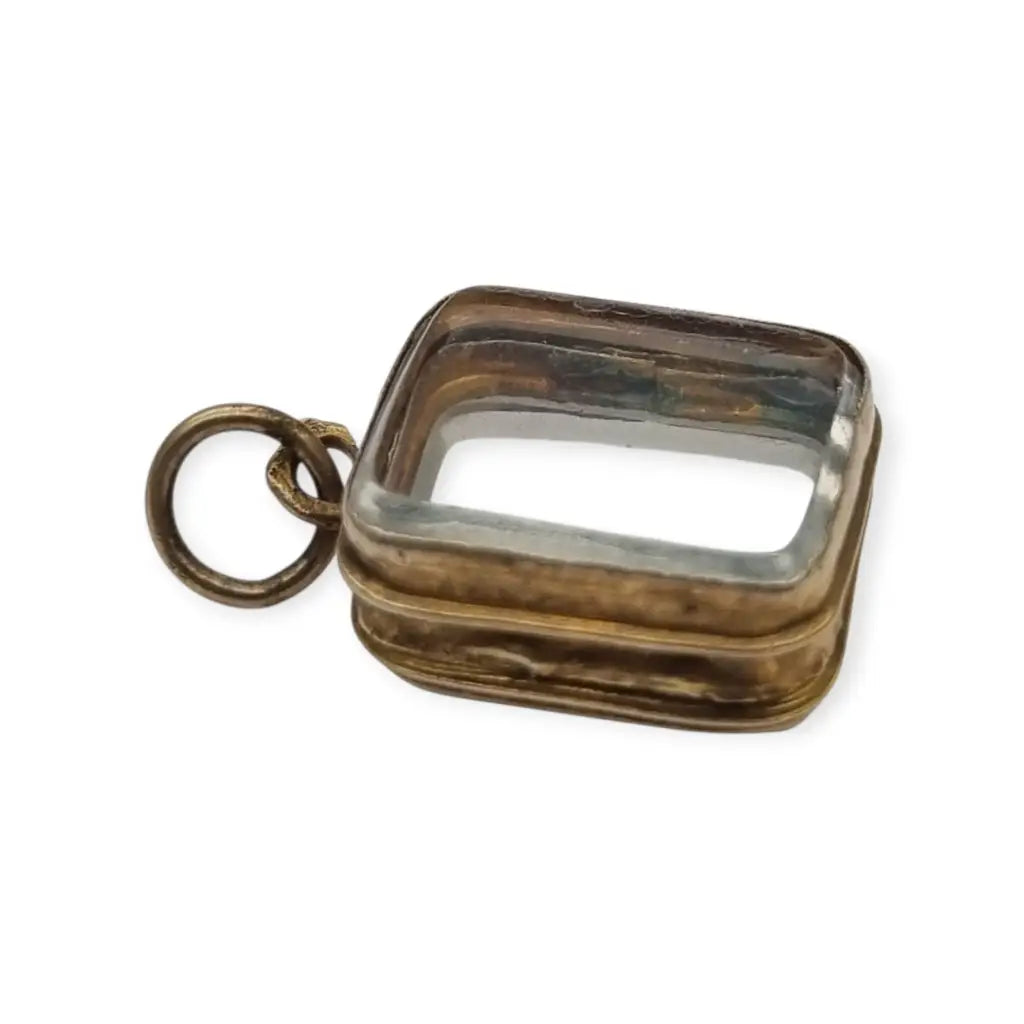 Colgante guardapelo antiguo rectangular doble cristal latón dorado siglo xix–xx.