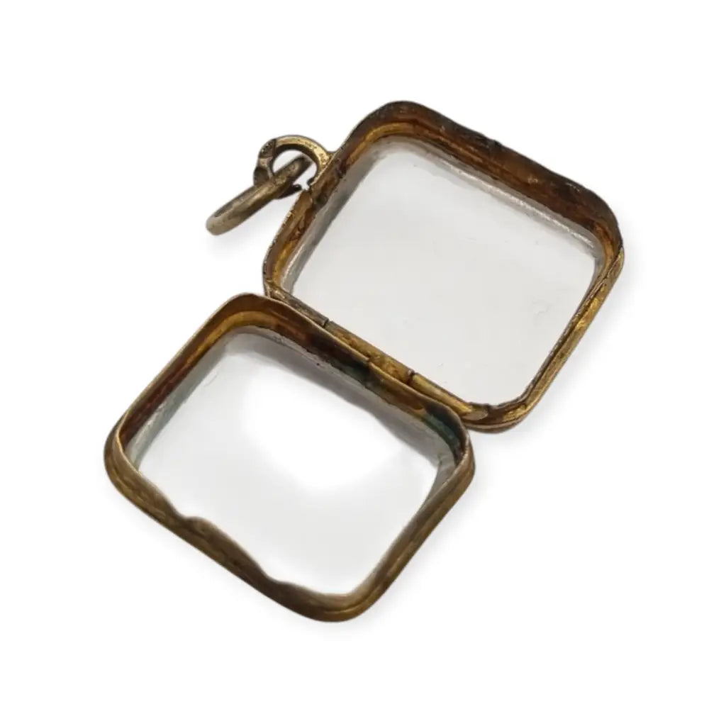 Colgante guardapelo antiguo rectangular doble cristal latón dorado siglo xix–xx.