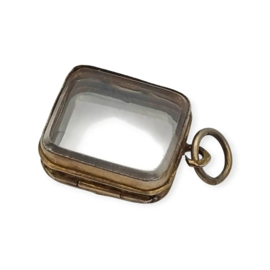 Colgante guardapelo antiguo rectangular doble cristal latón dorado siglo xix–xx.