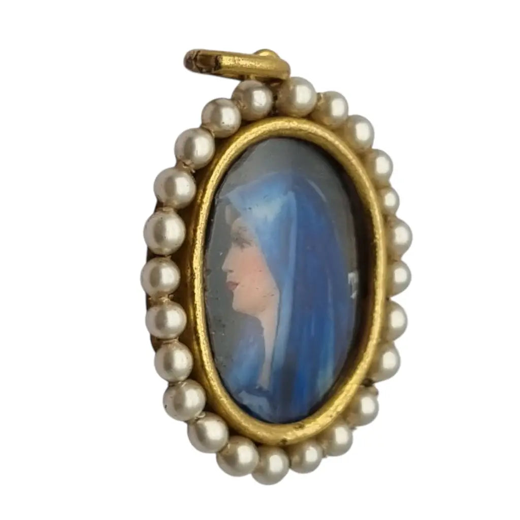 Colgante religioso con una Virgen azul pintada y firmada marco dorado