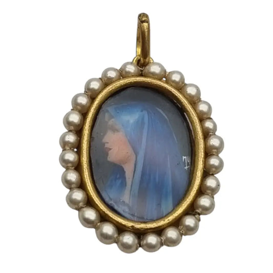 Colgante religioso con una Virgen azul pintada y firmada marco dorado