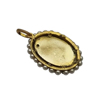 Colgante religioso con una Virgen azul pintada y firmada marco dorado