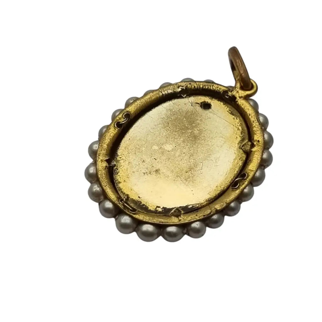 Colgante religioso con una Virgen azul pintada y firmada marco dorado