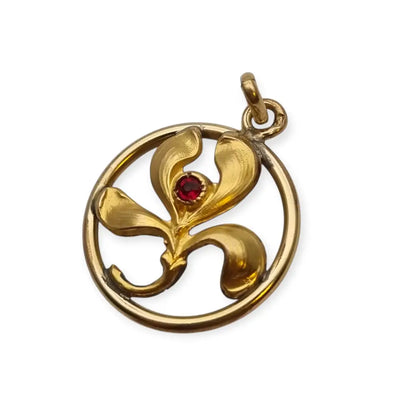 Colgante vintage art nouveau dorado con flor en círculo y piedra roja diseño