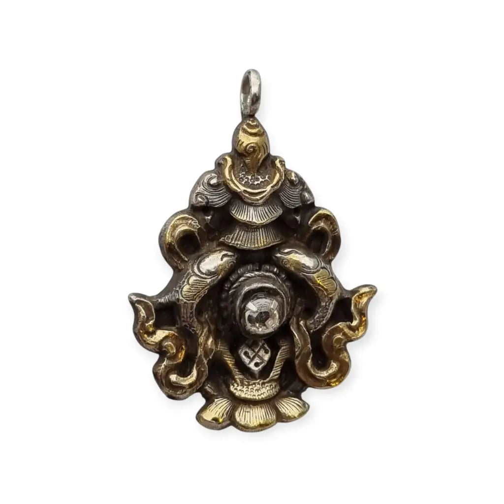 Colgante vintage de plata con baño dorado y símbolo tibetano piedra blanca