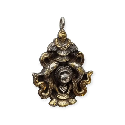 Colgante vintage de plata con baño dorado y símbolo tibetano piedra blanca