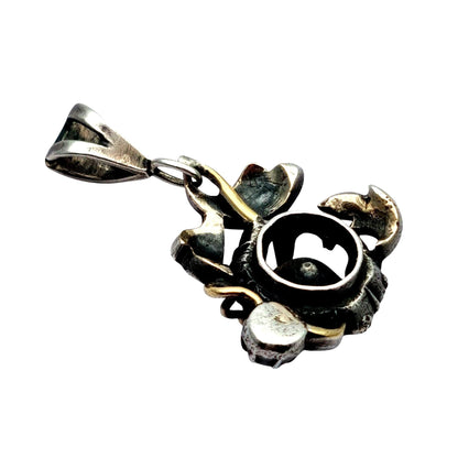Colgante floral victoriano en plata con diamantes y detalles en oro, circa 1890