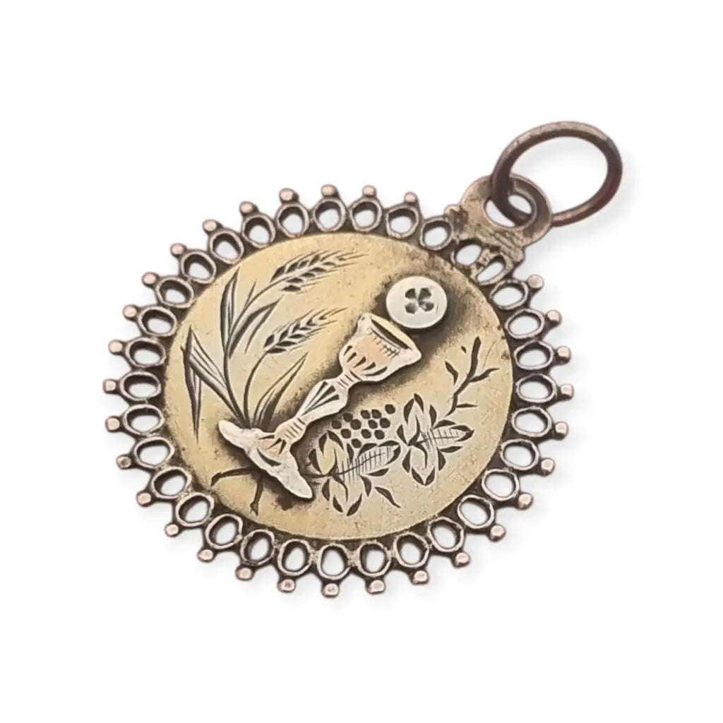 Medalla antigua de comunión en plata y grabado floral cáliz hostia pieza