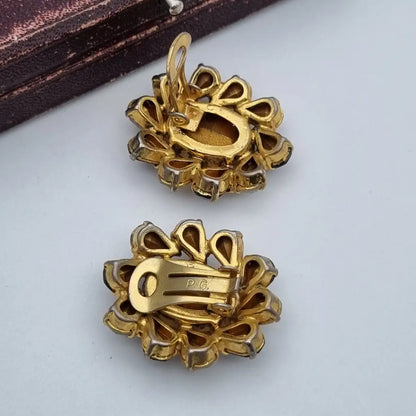 Pendientes vintage joyas doradas pedrería blanca y negra Purificación García PG