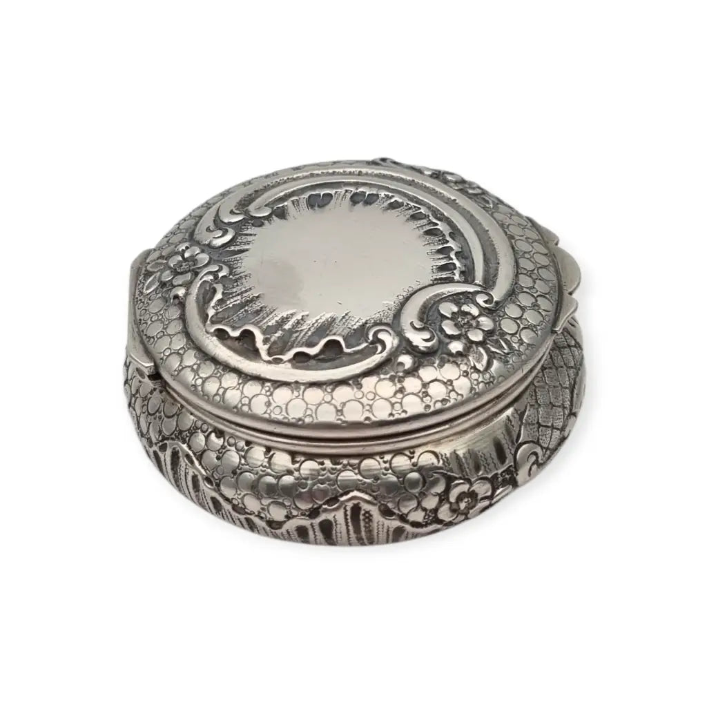 Polvera modernista en plata repujada con espejo interior Art Nouveau ca.