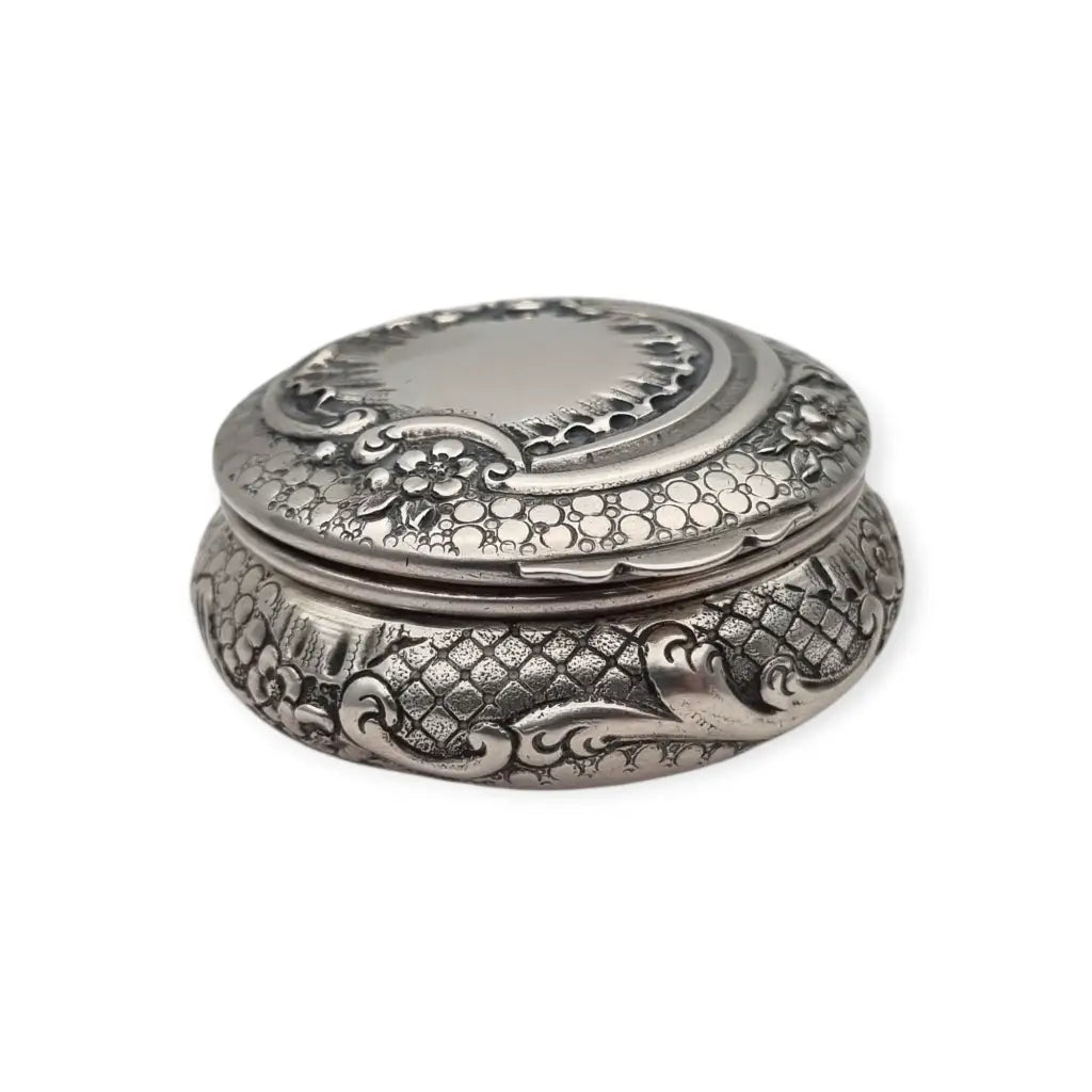 Polvera modernista en plata repujada con espejo interior Art Nouveau ca.