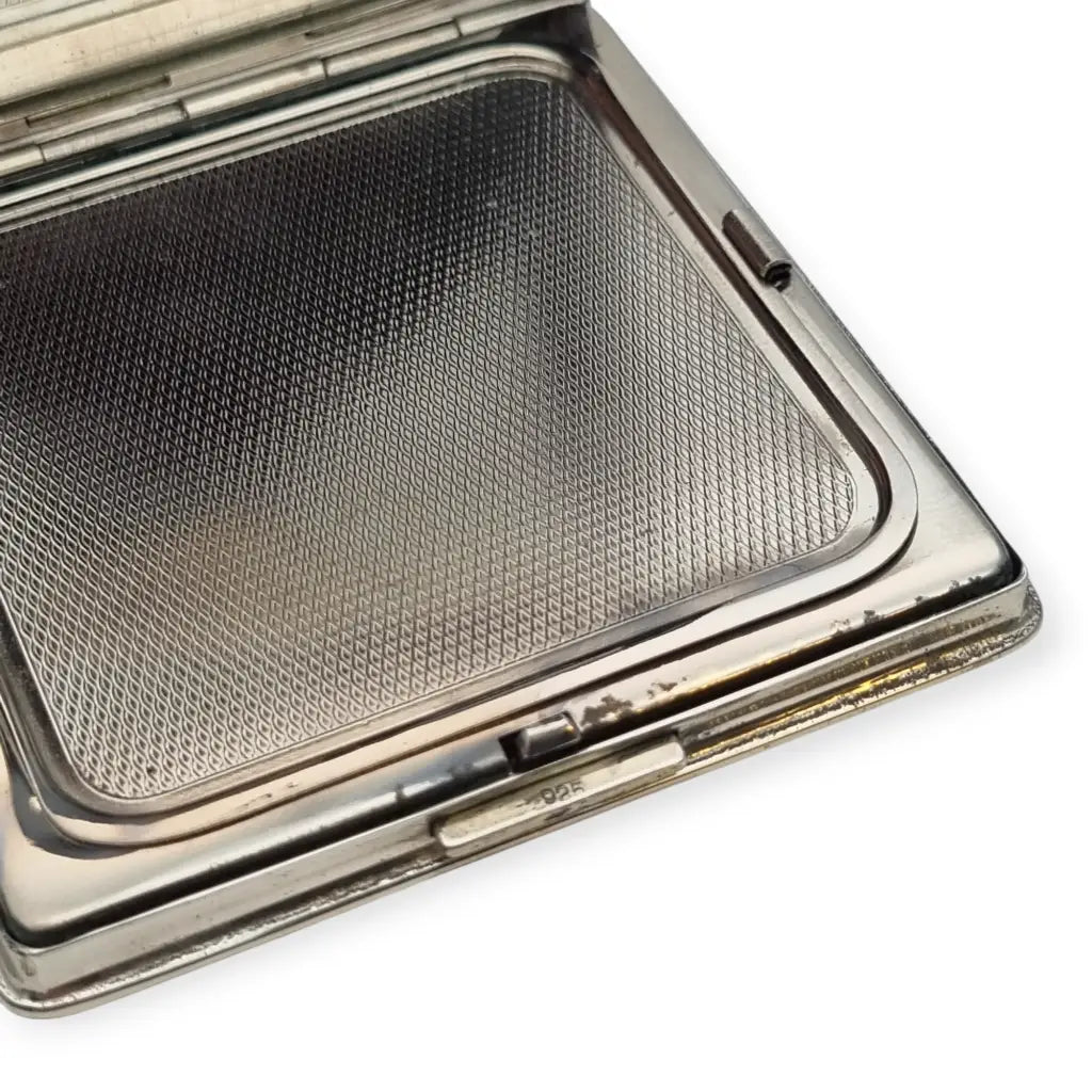 Polvera vintage años 50 en plata 925 con grabado estrellado y espejo interior.