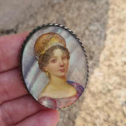 Antique brooch with hand-painted miniature, signed on mother-of-pearl, Fedoskino style, female portrait and metal frame.