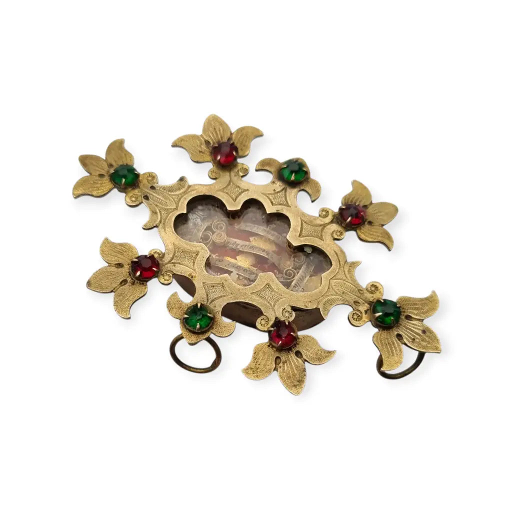 Relicario antiguo colgante con cinco reliquias selladas en metal dorado y gemas