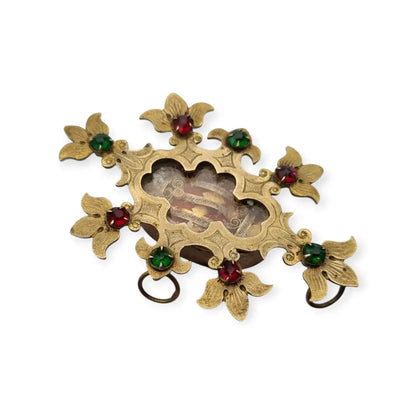 Relicario antiguo colgante con cinco reliquias selladas en metal dorado y gemas