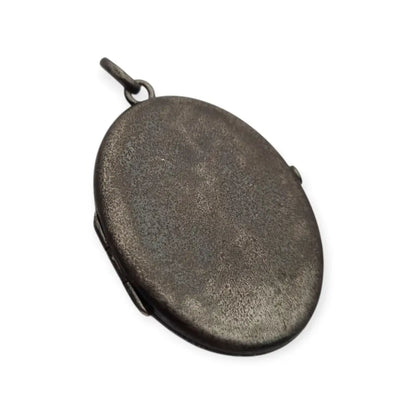 Relicario antiguo Guardapelo ovalado en metal oscuro Victoriano